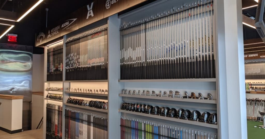 Club champion club wall full of different golf shafts