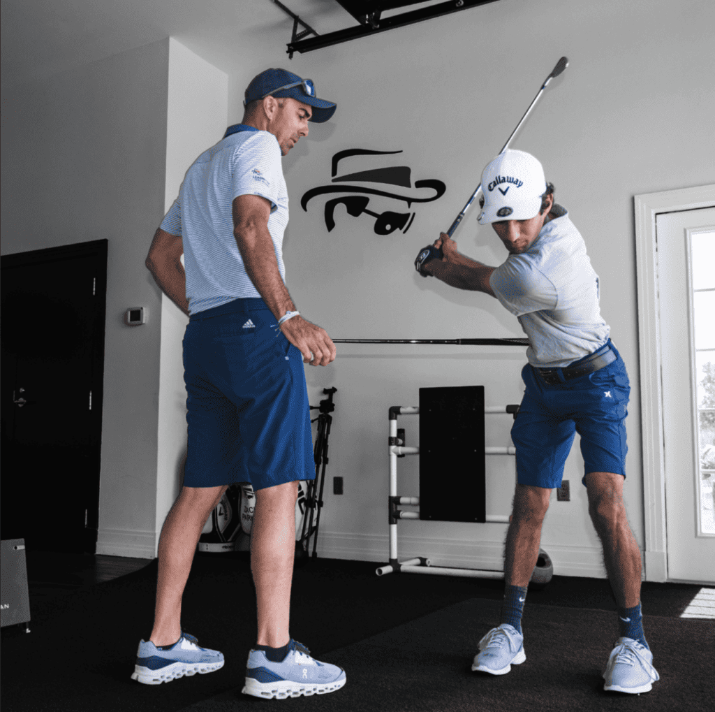 One of our certified golf instructors positioning his student for better results